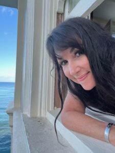 Kelly leaning out the window watching sea turtles